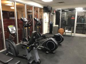 a gym with several treadmills and exercise bikes at Daytona Beach Resort 260 in Daytona Beach