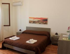 A bed or beds in a room at La Casetta
