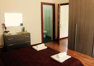 A bed or beds in a room at La Casetta