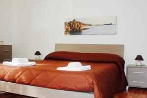 A bed or beds in a room at La Casetta