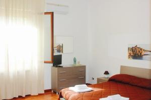 A bed or beds in a room at La Casetta