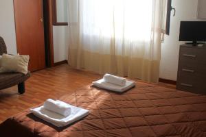 A bed or beds in a room at La Casetta