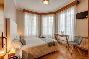 Posteľ alebo postele v izbe v ubytovaní Hostal Zahara