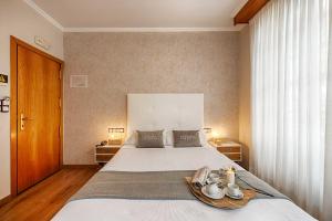 Posteľ alebo postele v izbe v ubytovaní Hostal Zahara