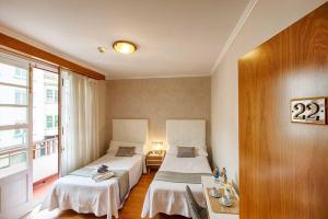 Posteľ alebo postele v izbe v ubytovaní Hostal Zahara