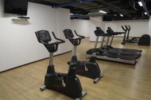 a row of exercise bikes in a gym at Boutique Apartment Downtown 1506 in Mexico City