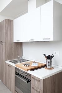a kitchen with a sink and a counter top at Palazzo Talenti 1907 in Trieste
