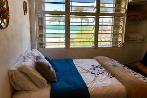 Voodi või voodid majutusasutuse Coco Mar Oceanview Studios toas