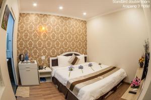 Giường trong phòng chung tại Arapang 3 Hotel