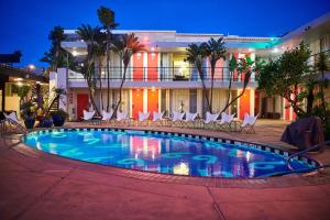 a swimming pool in front of a hotel at night at Phoenix Hotel in San Francisco