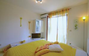 Postel nebo postele na pokoji v ubytování Apartment Rosana