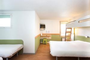 Postel nebo postele na pokoji v ubytování ibis budget Quimper
