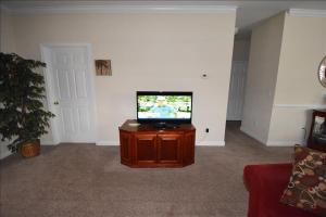 a living room with a flat screen tv on a table at 1011 Willow Bend Condo in North Myrtle Beach