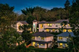 a row of homes at night at Sterling Wayanad in Sultan Bathery