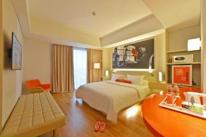 Ένα ή περισσότερα κρεβάτια σε δωμάτιο στο HARRIS Hotel & Conventions Solo