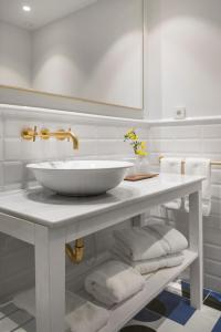 a bathroom with a white sink on a counter at Alta House Begur in Begur +48 photos
