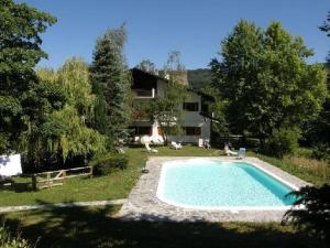 a swimming pool in the yard of a house at Agriturismo La Casa sul Poggio in Santo Stefano dʼAveto