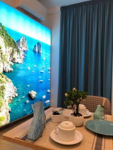 a large screen television in a dining room at Antica Capri B&B in Naples