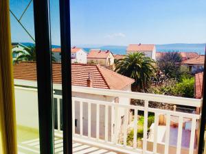 a view from a window of a balcony at Apartments Ruza in Kaštela