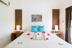 Rúm í herbergi á Phi Phi Bayview Resort