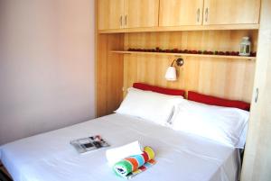 En eller flere senge i et værelse på Bnbook - Ferrarin Apartment