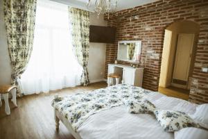 Postel nebo postele na pokoji v ubytování Paradisul Transilvaniei Resort