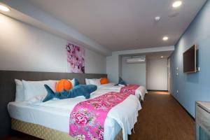 Postel nebo postele na pokoji v ubytování Wish Hotel