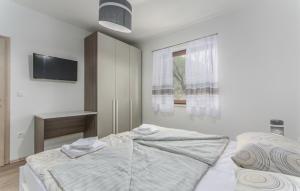 Postel nebo postele na pokoji v ubytování Apartments Katja