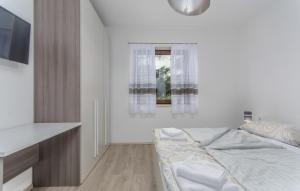 Postel nebo postele na pokoji v ubytování Apartments Katja