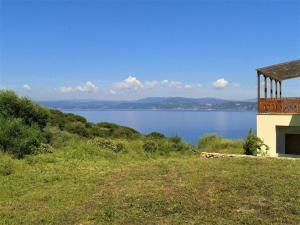 a house on a hill with a view of a lake at Marvelous Sea View Eco Apt in Ammouliani