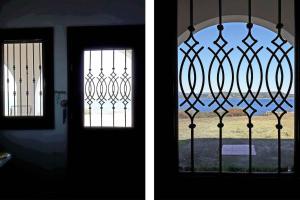 a door with a window with a view of a field at Marvelous Sea View Eco Apt in Ammouliani