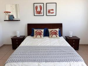 a bedroom with a large bed with two night stands at Siblings Nest 1 in Polis Chrysochous