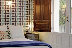 Postel nebo postele na pokoji v ubytování Apartamentos Mirador Alhambra