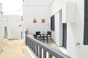 a view of a balcony with a table and chairs at Christina's Luxury Village House in Plaka Milou