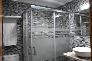 a bathroom with a shower and a sink at Hotel Carbayon in Oviedo +20 photos