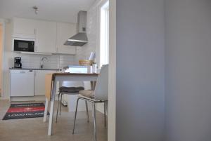 Kuchyň nebo kuchyňský kout v ubytování Sjöhuset