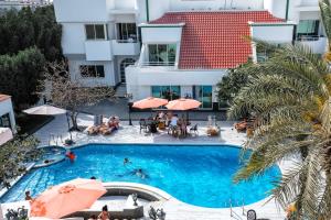 an overhead view of a swimming pool in a hotel at Al Khalidiah Resort in Sharjah