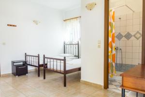 En eller flere senge i et værelse på Kaya Sea Apts - Stegna Beach