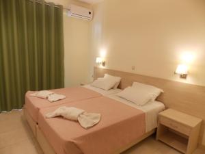 Postel nebo postele na pokoji v ubytování Alkyon Beach Hotel