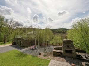 an aerial view of a house with a stone fireplace at Beautiful holiday home in Redu with whirlpool in Redu