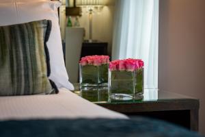 Voodi või voodid majutusasutuse Zuni Restaurant & Boutique Hotel toas