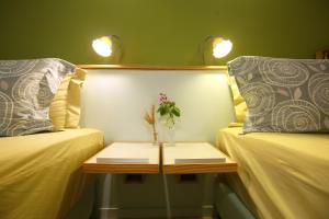 Postel nebo postele na pokoji v ubytování Huxi B&B