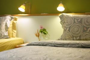 Postel nebo postele na pokoji v ubytování Huxi B&B