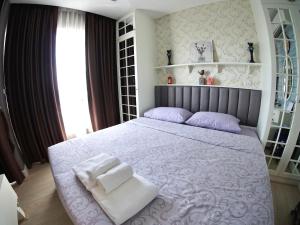 Postel nebo postele na pokoji v ubytování The Patio Bangsaen