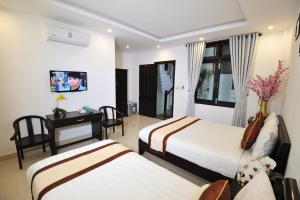 TV a/nebo společenská místnost v ubytování Hoi An Bali Homestay