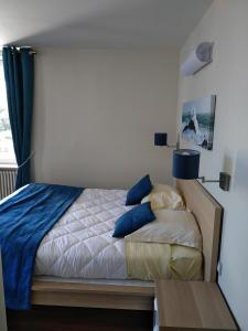 Postel nebo postele na pokoji v ubytování Hotel De La Mer