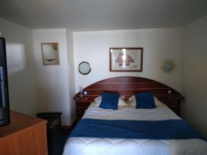 Postel nebo postele na pokoji v ubytování Hotel De La Mer