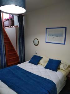 Postel nebo postele na pokoji v ubytování Hotel De La Mer