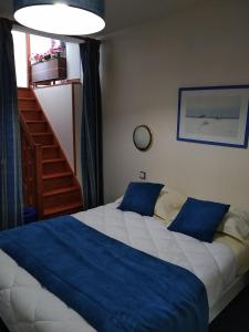 Postel nebo postele na pokoji v ubytování Hotel De La Mer