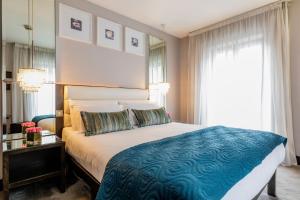 Voodi või voodid majutusasutuse Zuni Restaurant & Boutique Hotel toas